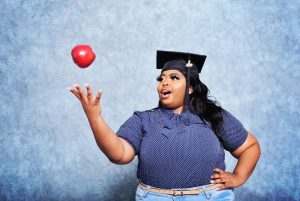 Dayeashia Viel, graduate, tosses apple