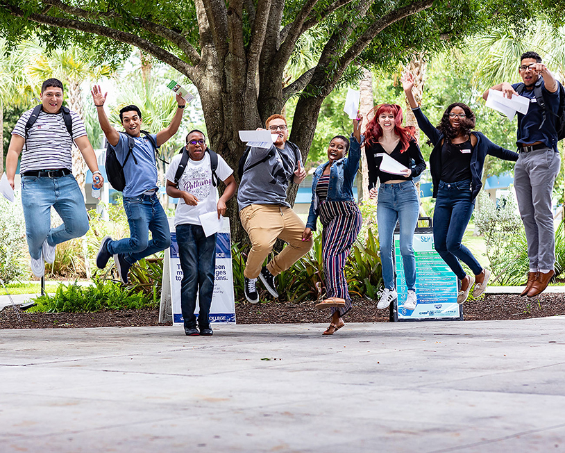 students jump in the air to celebrate college!