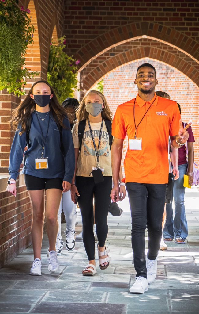 student peer leaders march excitedly toward workshop