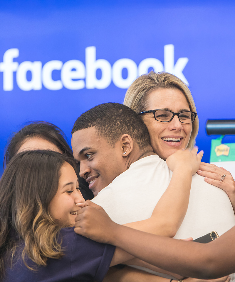 peerforward team smiles at facebook event