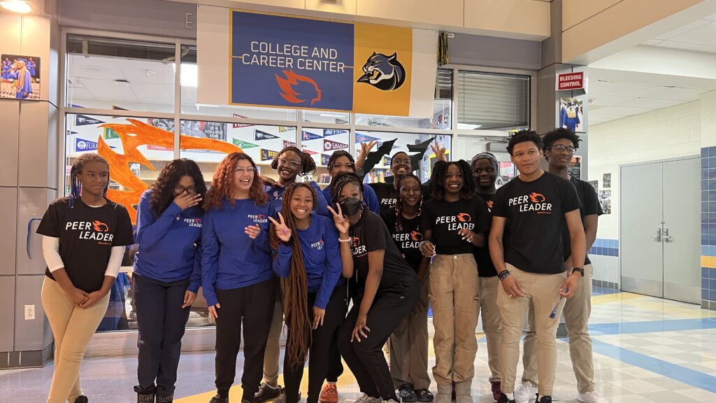 Peer Leaders pose in front of their college and career center