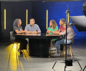 PeerForward CEO Gary Linnen and Peer Leader Erica Luzon sit at a table on a LTX Quest panel