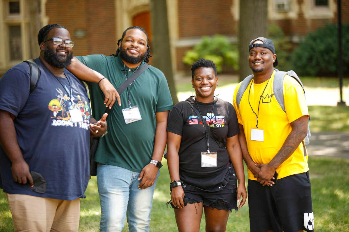 Sheldon Hill poses in group of volunteers